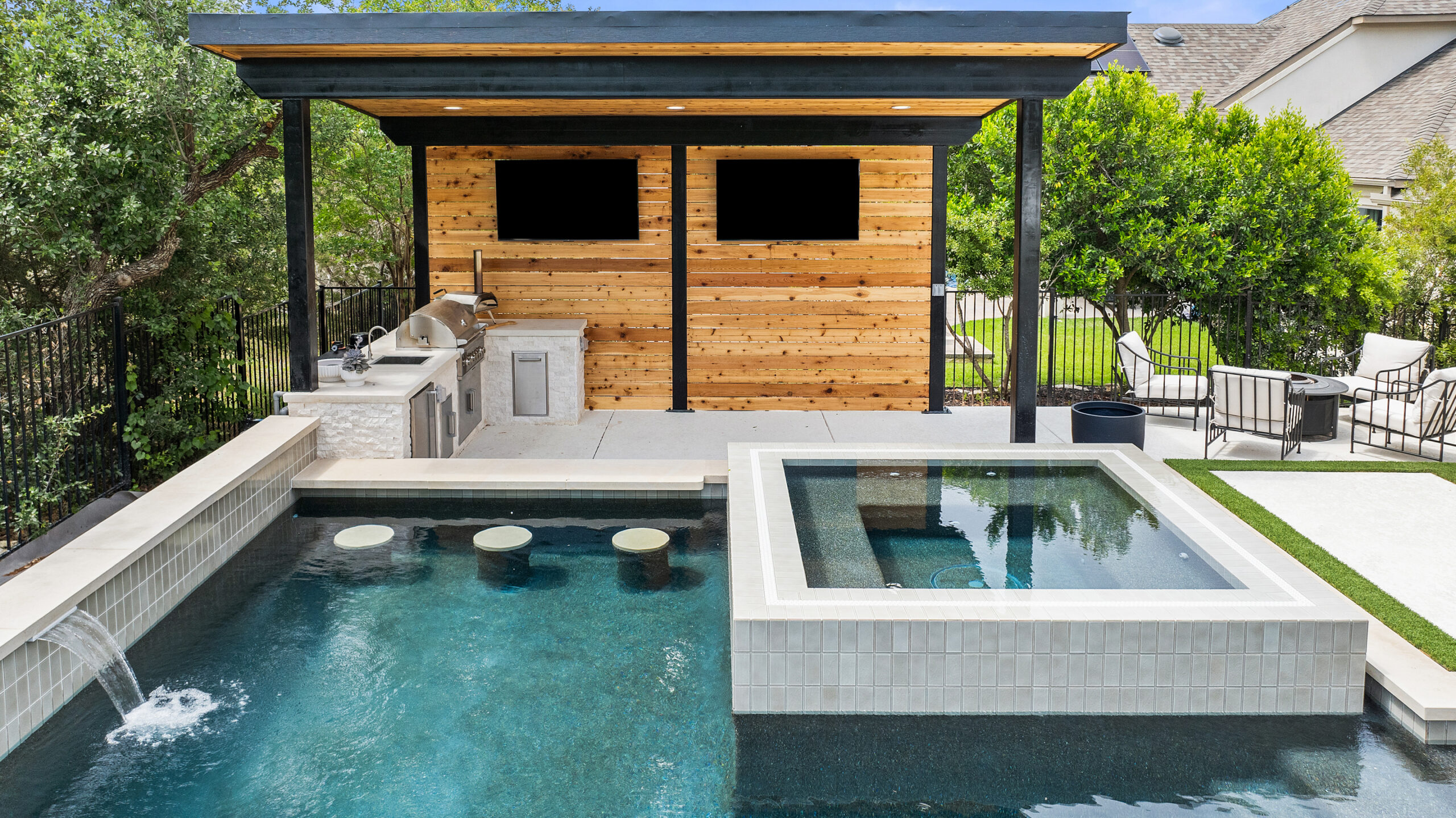 Luxury backyard pool in Austin designed for entertaining by Wild Basin Pools