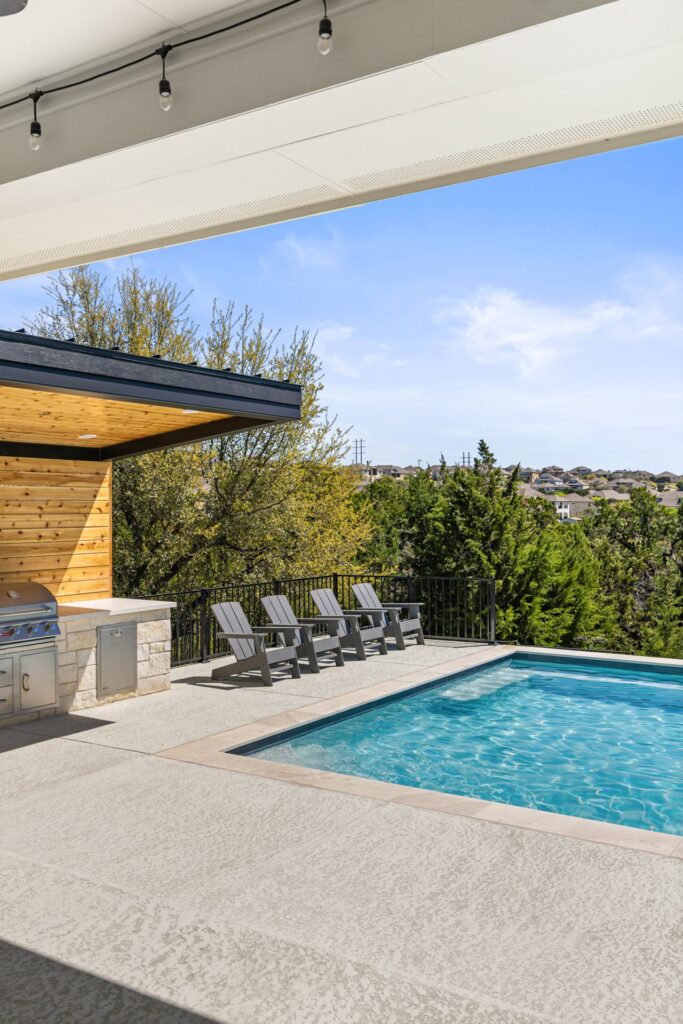 Azure Terrace lounge area and geometric pool with Hill Country backdrop by Wild Basin Pools Austin TX