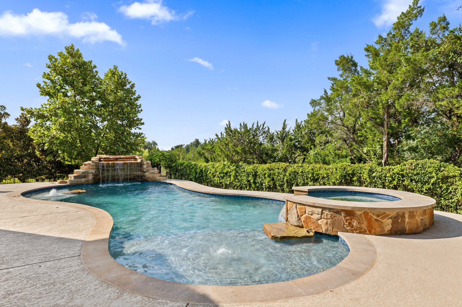 Austin custom pool enjoyed during fall by Wild Basin Pools